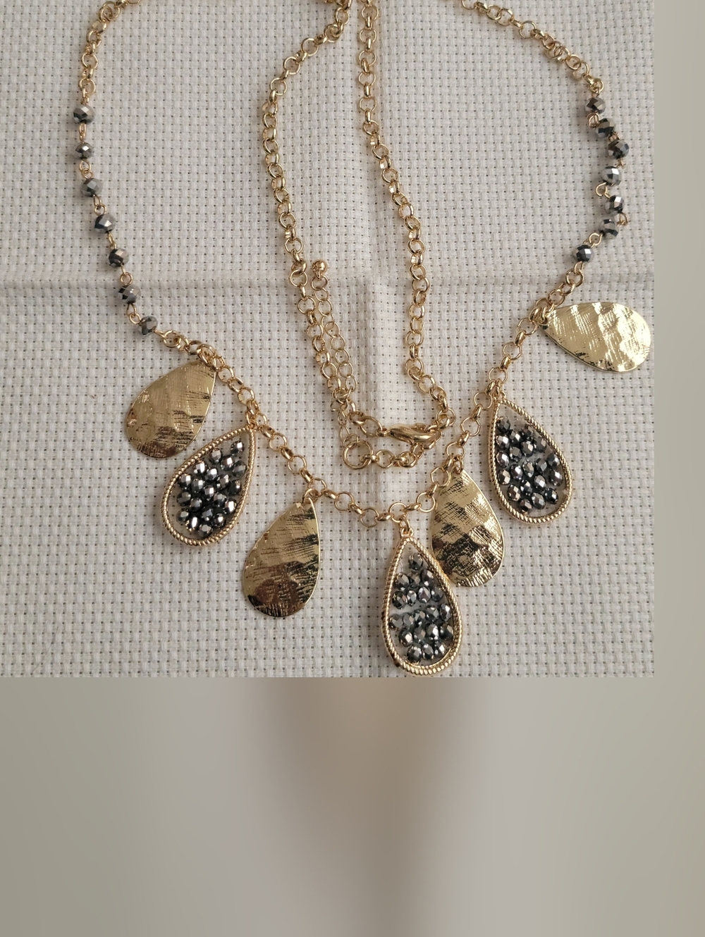 Gold Teardrop Pendant Necklace with Black Crystal Accents